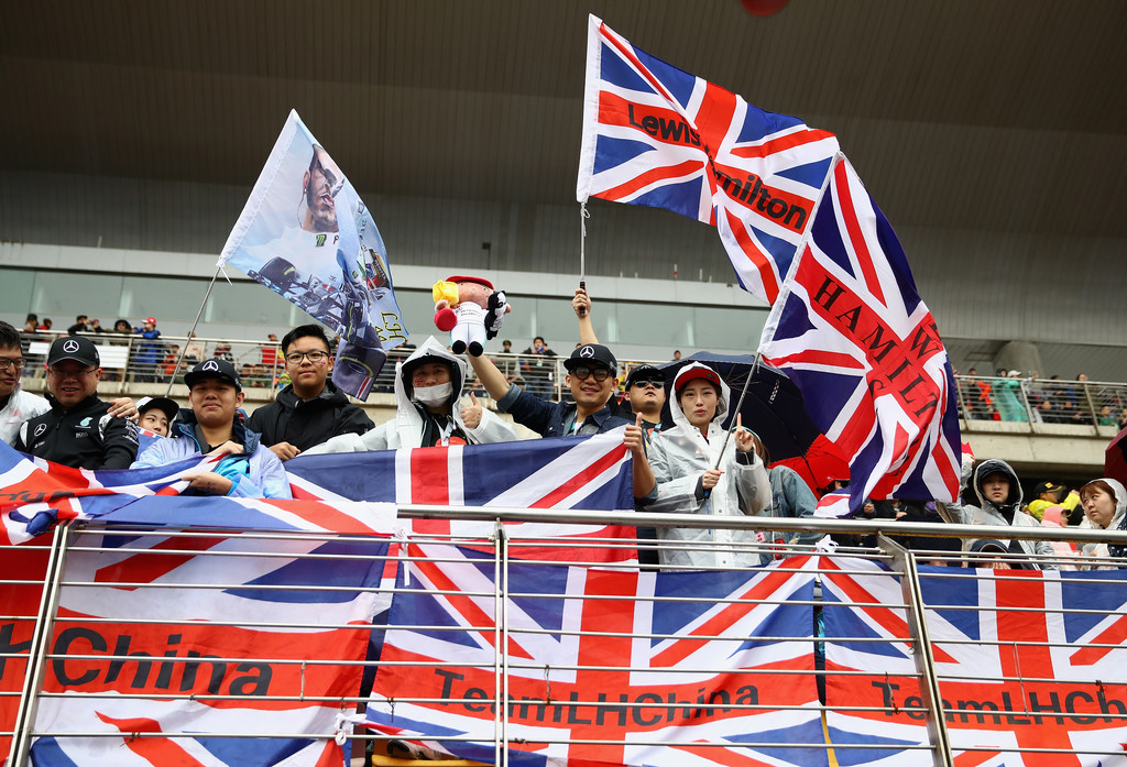 Lewis Hamilton of Great Britain and Mercedes GP fans in the grandstand during the Formula One Grand Prix of China at Shanghai International Circuit on April 9, 2017 in Shanghai, China. Lewis Hamilton of Great Britain and Mercedes GP fans in the grandstand during the Formula One Grand Prix of China at Shanghai International Circuit on April 9, 2017 in Shanghai, China.