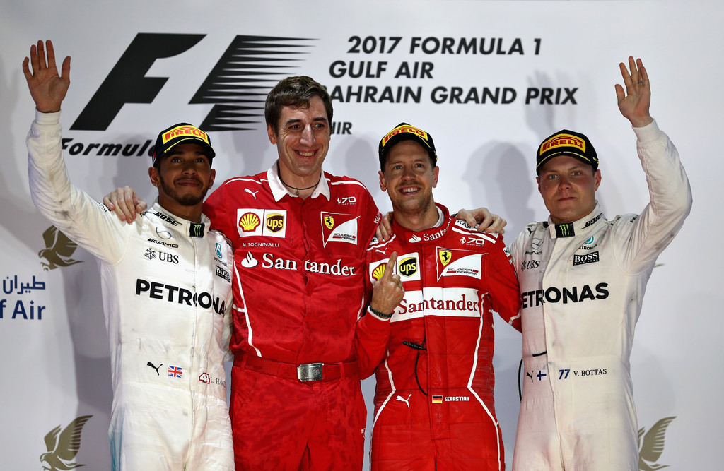 Top three finishers Sebastian Vettel of Germany and Ferrari, Lewis Hamilton of Great Britain and Mercedes GP and Valtteri Bottas of Finland and Mercedes GP on the podium during the Bahrain Formula One Grand Prix at Bahrain International Circuit on April 16, 2017 in Bahrain, Bahrain. Top three finishers Sebastian Vettel of Germany and Ferrari, Lewis Hamilton of Great Britain and Mercedes GP and Valtteri Bottas of Finland and Mercedes GP on the podium during the Bahrain Formula One Grand Prix at Bahrain International Circuit on April 16, 2017 in Bahrain, Bahrain.