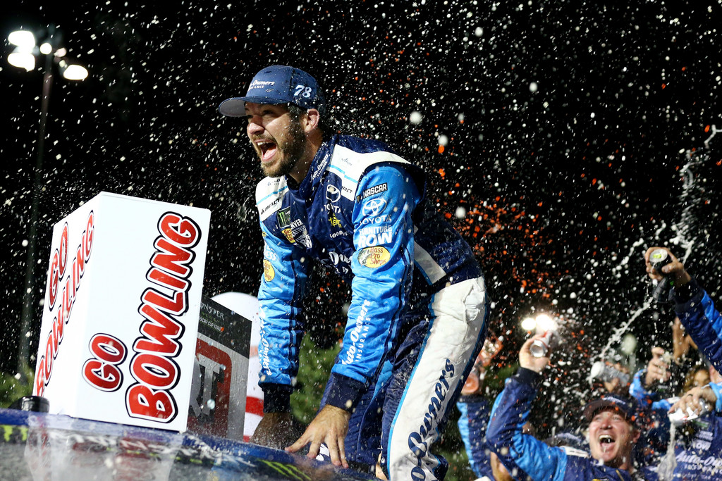 Martin Truex Jr., driver of the #78 Auto-Owners Insurance Toyota, celebrates in Victory Lane after winning the Monster Energy NASCAR Cup Series Go Bowling 400 at Kansas Speedway on May 13, 2017 in Kansas City, Kansas. Martin Truex Jr., driver of the #78 Auto-Owners Insurance Toyota, celebrates in Victory Lane after winning the Monster Energy NASCAR Cup Series Go Bowling 400 at Kansas Speedway on May 13, 2017 in Kansas City, Kansas.
