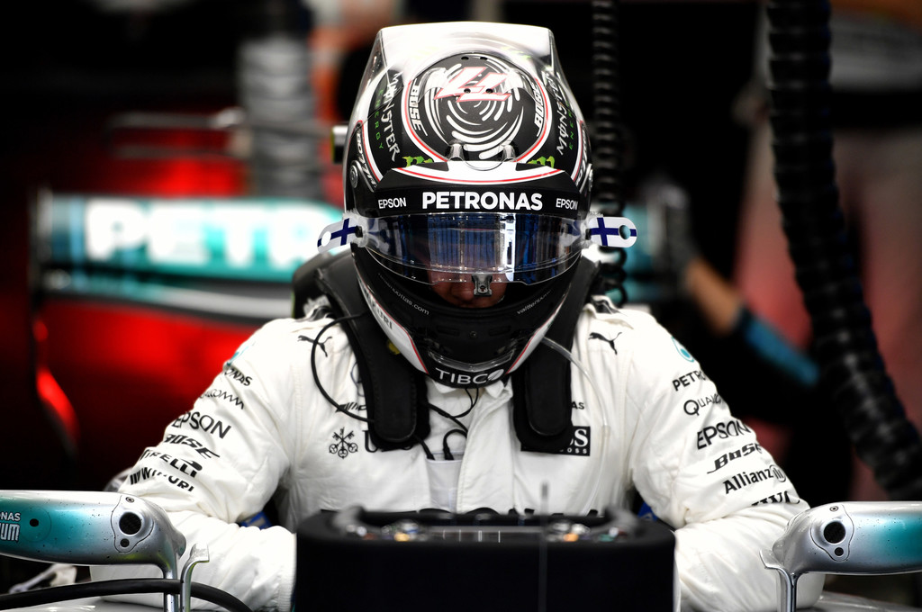 Mercedes' Finnish driver Valtteri Bottas prepares in the pits ahead of the Bahrain Formula One Grand Prix at the Sakhir circuit in Manama on April 16, 2017. Mercedes' Finnish driver Valtteri Bottas prepares in the pits ahead of the Bahrain Formula One Grand Prix at the Sakhir circuit in Manama on April 16, 2017.