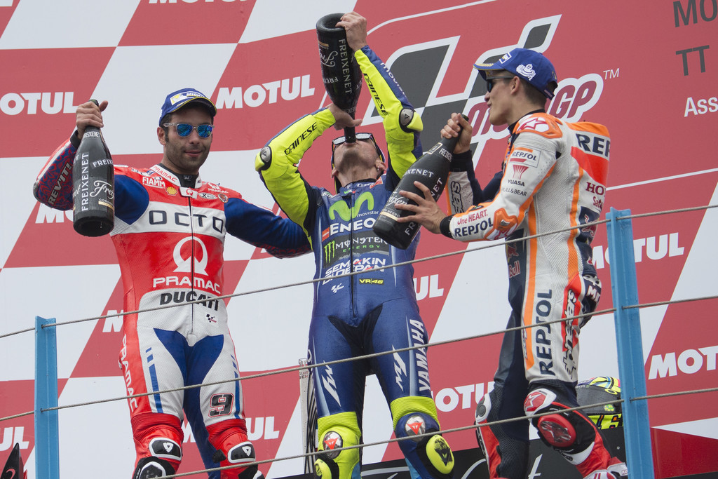 Danilo Petrucci of Italy and Octo Pramac Yakhnich, Valentino Rossi of Italy and Movistar Yamaha MotoGP and Marc Marquez of Spain and Repsol Honda Team celebrate on the podium at the end of the MotoGP Race during the MotoGP Netherlands - Race on June 25, 2017 in Assen, Netherlands. Danilo Petrucci of Italy and Octo Pramac Yakhnich, Valentino Rossi of Italy and Movistar Yamaha MotoGP and Marc Marquez of Spain and Repsol Honda Team celebrate on the podium at the end of the MotoGP Race during the MotoGP Netherlands - Race on June 25, 2017 in Assen, Netherlands.