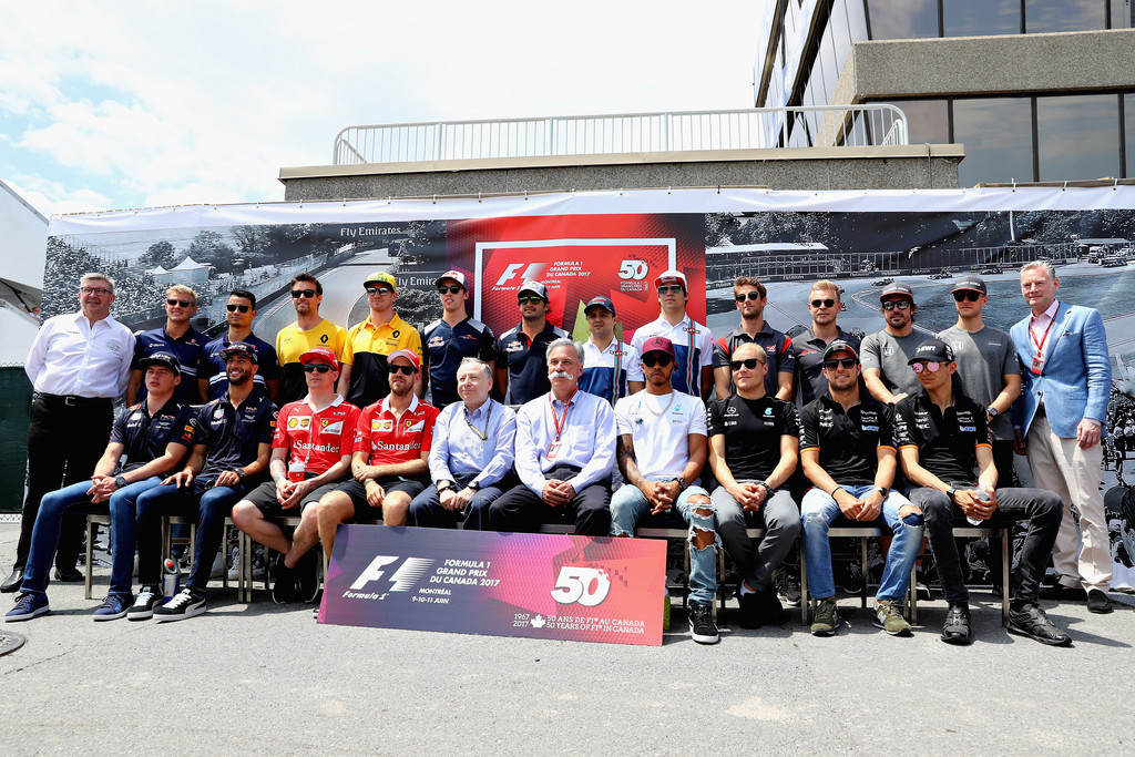 The F1 drivers and leadership stand together to celebrate 50 years of the Canadian Grand Prix during the Canadian Formula One Grand Prix at Circuit Gilles Villeneuve on June 11, 2017 in Montreal, Canada. The F1 drivers and leadership stand together to celebrate 50 years of the Canadian Grand Prix during the Canadian Formula One Grand Prix at Circuit Gilles Villeneuve on June 11, 2017 in Montreal, Canada.