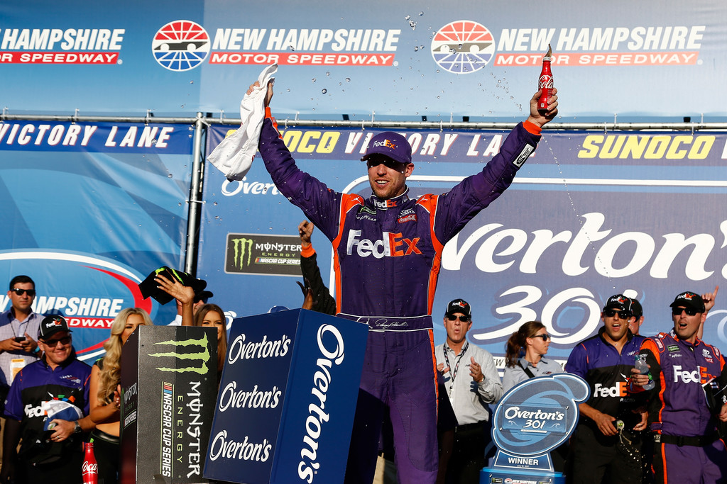 Denny Hamlin, driver of the #11 FedEx Office Toyota, celebrates in Victory Lane after winning the Monster Energy NASCAR Cup Series Overton's 301 at New Hampshire Motor Speedway on July 16, 2017 in Loudon, New Hampshire. Denny Hamlin, driver of the #11 FedEx Office Toyota, celebrates in Victory Lane after winning the Monster Energy NASCAR Cup Series Overton's 301 at New Hampshire Motor Speedway on July 16, 2017 in Loudon, New Hampshire.
