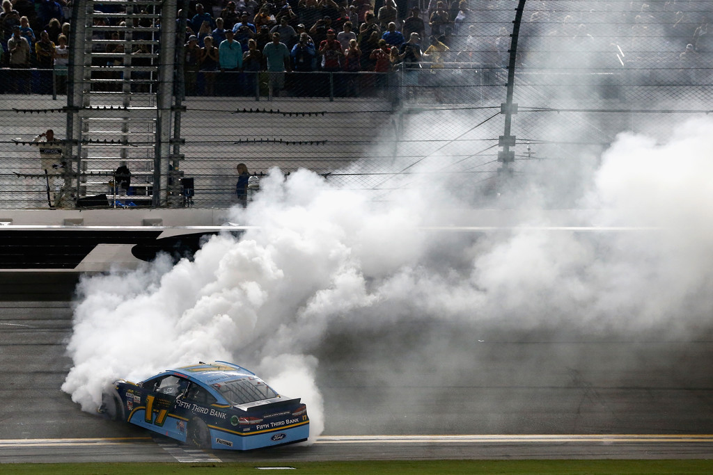 Ricky Stenhouse Jr., driver of the #17 Fifth Thrid Bank Ford, celebrates with a burnout after winning the Monster Energy NASCAR Cup Series 59th Annual Coke Zero 400 Powered By Coca-Cola at Daytona International Speedway on July 1, 2017 in Daytona Beach, Florida. Ricky Stenhouse Jr., driver of the #17 Fifth Thrid Bank Ford, celebrates with a burnout after winning the Monster Energy NASCAR Cup Series 59th Annual Coke Zero 400 Powered By Coca-Cola at Daytona International Speedway on July 1, 2017 in Daytona Beach, Florida.