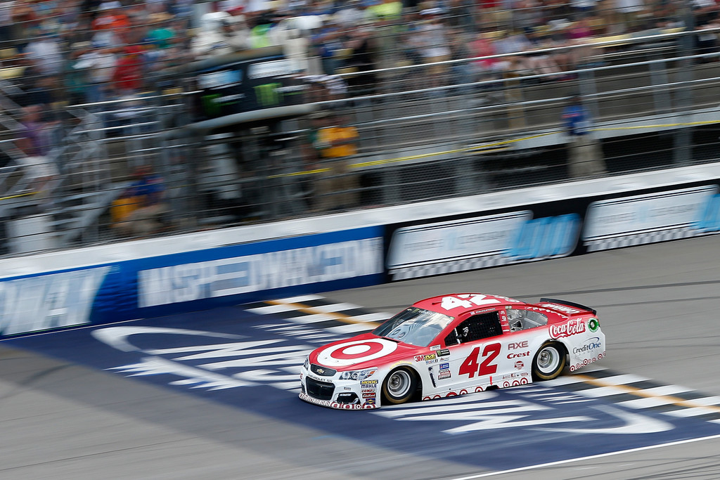 Kyle Larson, driver of the #42 Target Chevrolet, takes the checkered flag to win the Monster Energy NASCAR Cup Series Pure Michigan 400 at Michigan International Speedway on August 13, 2017 in Brooklyn, Michigan. Kyle Larson, driver of the #42 Target Chevrolet, takes the checkered flag to win the Monster Energy NASCAR Cup Series Pure Michigan 400 at Michigan International Speedway on August 13, 2017 in Brooklyn, Michigan.