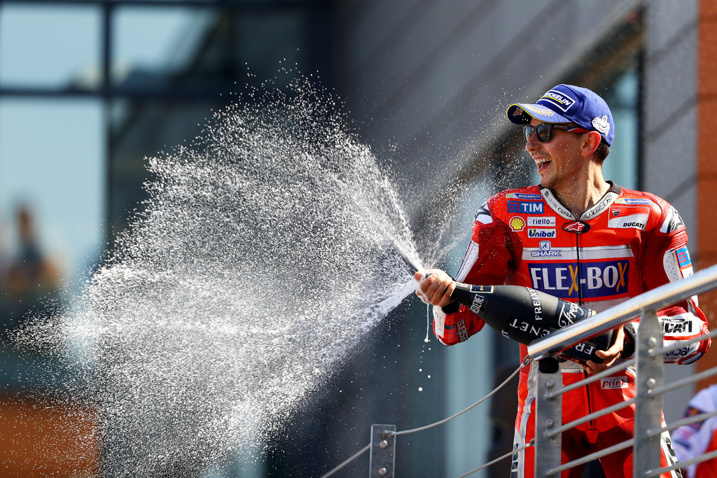 Jorge Lorenzo of Spain and the Ducati Team celebrates on the podium after finishing third in the MotoGP of Aragon at Motorland Aragon Circuit on September 24, 2017 in Alcaniz, Spain. Jorge Lorenzo of Spain and the Ducati Team celebrates on the podium after finishing third in the MotoGP of Aragon at Motorland Aragon Circuit on September 24, 2017 in Alcaniz, Spain.