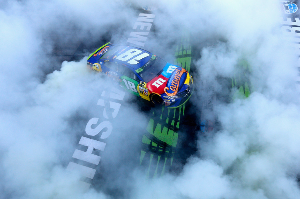 Kyle Busch, driver of the #18 M&M's Caramel Toyota, celebrates with a burnout after winning the Monster Energy NASCAR Cup Series ISM Connect 300 at New Hampshire Motor Speedway on September 24, 2017 in Loudon, New Hampshire. Kyle Busch, driver of the #18 M&M's Caramel Toyota, celebrates with a burnout after winning the Monster Energy NASCAR Cup Series ISM Connect 300 at New Hampshire Motor Speedway on September 24, 2017 in Loudon, New Hampshire.