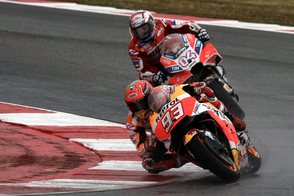 Marc Marquez of Spain and Repsol Honda Team leads Andrea Dovizioso of Italy and Ducati Team during the MotoGP Race during the MotoGP of San Marino - Race at Misano World Circuit on September 10, 2017 in Misano Adriatico, Italy. Marc Marquez of Spain and Repsol Honda Team leads Andrea Dovizioso of Italy and Ducati Team during the MotoGP Race during the MotoGP of San Marino - Race at Misano World Circuit on September 10, 2017 in Misano Adriatico, Italy.