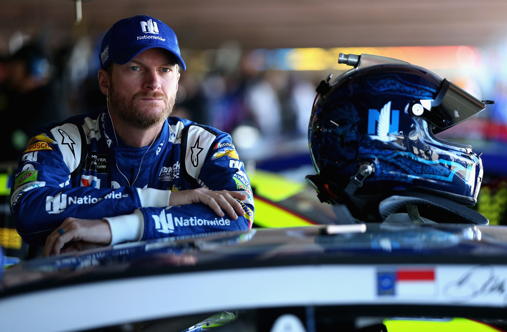 Dale Earnhardt Jr., driver of the #88 Nationwide Chevrolet, stands in the garage area during practice for the Monster Energy NASCAR Cup Series Apache Warrior 400 presented by Lucas Oil at Dover International Speedway on September 29, 2017 in Dover, Delaware. Dale Earnhardt Jr., driver of the #88 Nationwide Chevrolet, stands in the garage area during practice for the Monster Energy NASCAR Cup Series Apache Warrior 400 presented by Lucas Oil at Dover International Speedway on September 29, 2017 in Dover, Delaware.