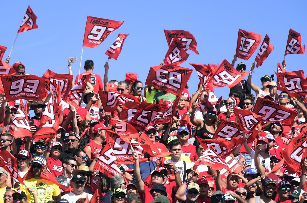 Repsol Honda Team's Spanish rider Marc Marquez fans cheer up during MotoGP race of the Moto Grand Prix of Aragon at the Motorland circuit in Alcaniz on September 24, 2017. Repsol Honda Team's Spanish rider Marc Marquez fans cheer up during MotoGP race of the Moto Grand Prix of Aragon at the Motorland circuit in Alcaniz on September 24, 2017.