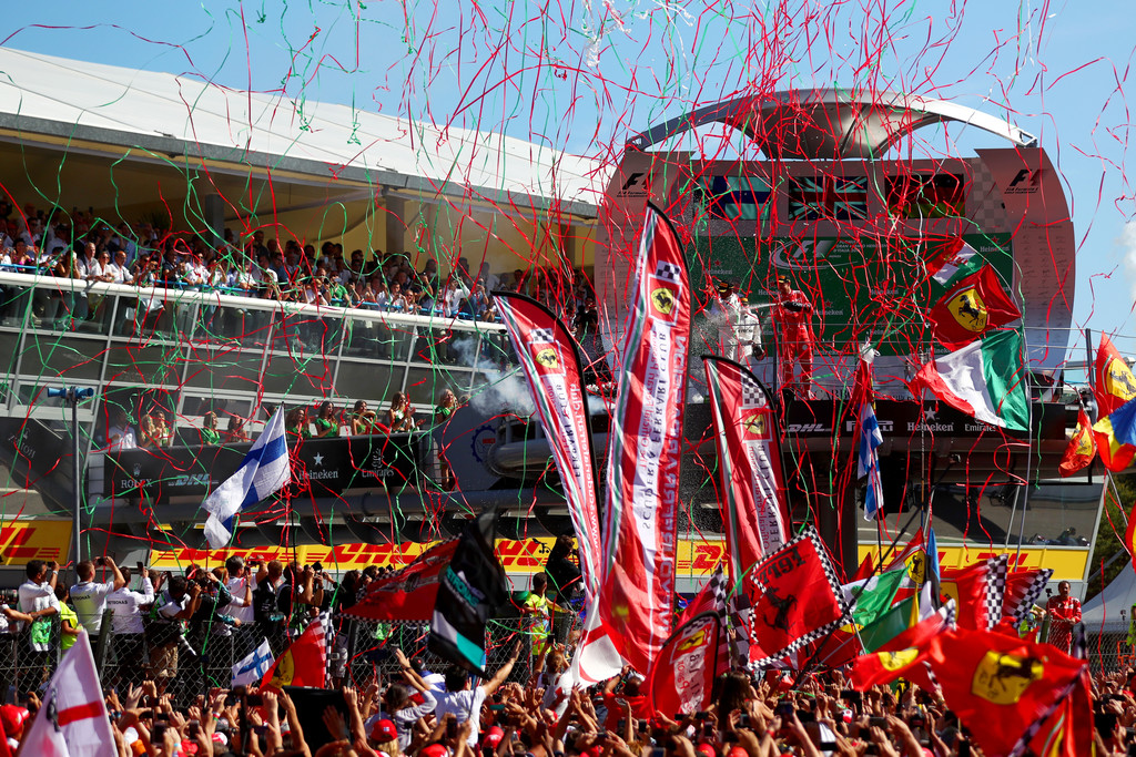 Top three finishers Lewis Hamilton of Great Britain and Mercedes GP, Valtteri Bottas of Finland and Mercedes GP and Sebastian Vettel of Germany and Ferrari celebrate on the podium during the Formula One Grand Prix of Italy at Autodromo di Monza on September 3, 2017 in Monza, Italy.