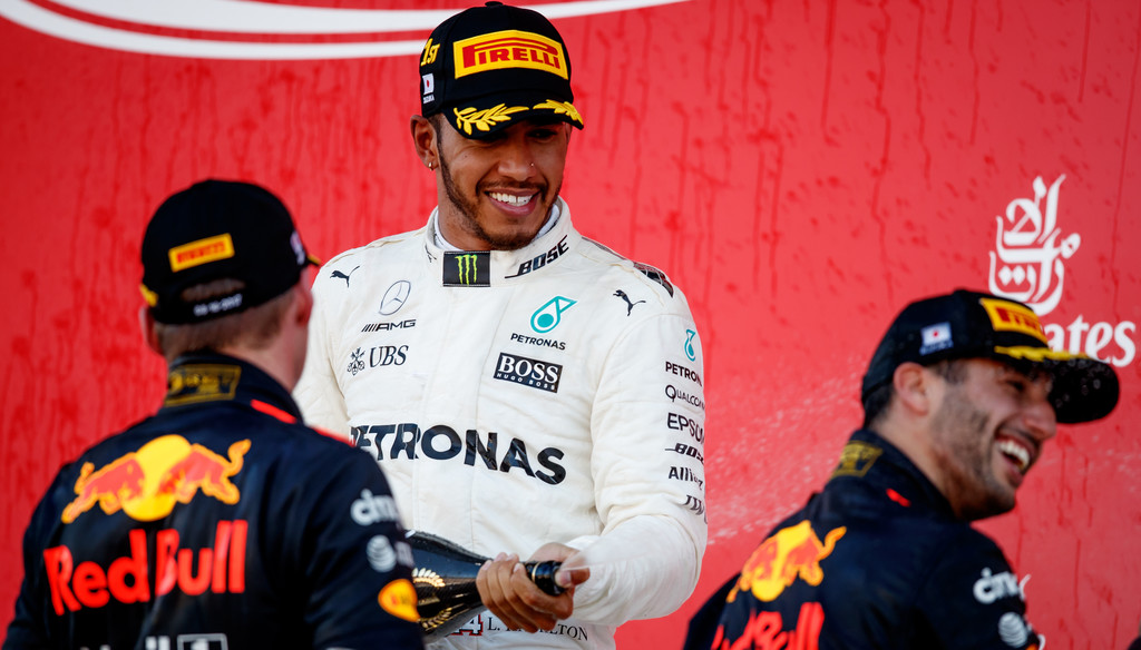 Race winner Lewis Hamilton of Great Britain and Mercedes GP celebrates on the podium with Max Verstappen of Netherlands and Red Bull Racing and Daniel Ricciardo of Australia and Red Bull Racing during the Formula One Grand Prix of Japan at Suzuka Circuit on October 8, 2017 in Suzuka. Race winner Lewis Hamilton of Great Britain and Mercedes GP celebrates on the podium with Max Verstappen of Netherlands and Red Bull Racing and Daniel Ricciardo of Australia and Red Bull Racing during the Formula One Grand Prix of Japan at Suzuka Circuit on October 8, 2017 in Suzuka.
