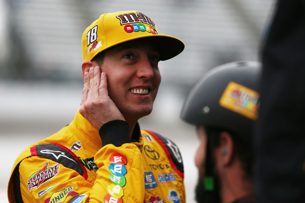 Kyle Busch, driver of the #18 M&M's Halloween Toyota, stands on the grid before qualifying for the Monster Energy NASCAR Cup Series First Data 500 at Martinsville Speedway on October 29, 2017 in Martinsville, Virginia Kyle Busch, driver of the #18 M&M's Halloween Toyota, stands on the grid before qualifying for the Monster Energy NASCAR Cup Series First Data 500 at Martinsville Speedway on October 29, 2017 in Martinsville, Virginia