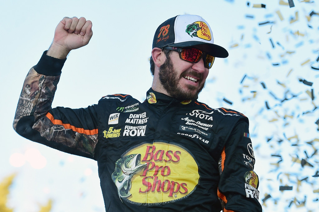 Martin Truex Jr., driver of the #78 Bass Pro Shops/Tracker Boats Toyota, celebrates in Victory Lane after winning the Monster Energy NASCAR Cup Series Hollywood Casino 400 at Kansas Speedway on October 22, 2017 in Kansas City, Kansas. Martin Truex Jr., driver of the #78 Bass Pro Shops/Tracker Boats Toyota, celebrates in Victory Lane after winning the Monster Energy NASCAR Cup Series Hollywood Casino 400 at Kansas Speedway on October 22, 2017 in Kansas City, Kansas.