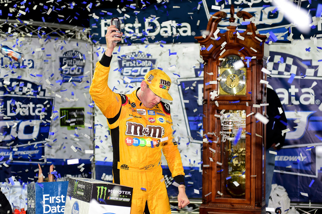 Kyle Busch, driver of the #18 M&M's Halloween Toyota, celebrates in Victory Lane after winning the Monster Energy NASCAR Cup Series First Data 500 at Martinsville Speedway on October 29, 2017 in Martinsville, Virginia. Kyle Busch, driver of the #18 M&M's Halloween Toyota, celebrates in Victory Lane after winning the Monster Energy NASCAR Cup Series First Data 500 at Martinsville Speedway on October 29, 2017 in Martinsville, Virginia.