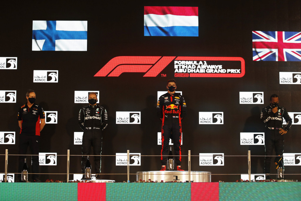 Race winner Max Verstappen of Netherlands and Red Bull Racing, second placed Valtteri Bottas of Finland and Mercedes GP, third placed Lewis Hamilton of Great Britain and Mercedes GP and Red Bull Racing Head of Car Engineering Paul Monaghan celebrate on the podium during the F1 Grand Prix of Abu Dhabi at Yas Marina Circuit on December 13, 2020 in Abu Dhabi, United Arab Emirates. Race winner Max Verstappen of Netherlands and Red Bull Racing, second placed Valtteri Bottas of Finland and Mercedes GP, third placed Lewis Hamilton of Great Britain and Mercedes GP and Red Bull Racing Head of Car Engineering Paul Monaghan celebrate on the podium during the F1 Grand Prix of Abu Dhabi at Yas Marina Circuit on December 13, 2020 in Abu Dhabi, United Arab Emirates.