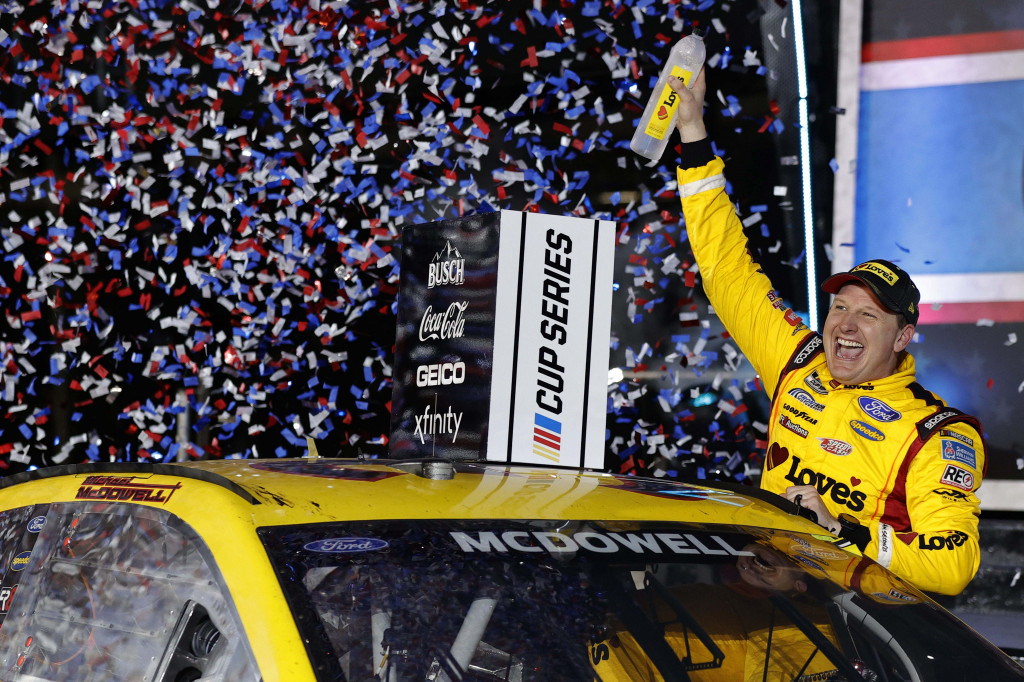 Michael McDowell, driver of the #34 Love’s Travel Stops Ford, celebrates in victory lane after winning the NASCAR Cup Series 63rd Annual Daytona 500 at Daytona International Speedway on February 14, 2021 in Daytona Beach, Florida. (Photo by Jared C. Tilton/Getty Images). Michael McDowell, driver of the #34 Love’s Travel Stops Ford, celebrates in victory lane after winning the NASCAR Cup Series 63rd Annual Daytona 500 at Daytona International Speedway on February 14, 2021 in Daytona Beach, Florida. (Photo by Jared C. Tilton/Getty Images).